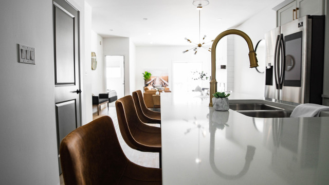 plumber fixing sink kitchen